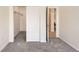 Bedroom featuring closet, neutral paint, and doors to other areas of the home at 9557 Pearl Cir # 204, Parker, CO 80134