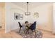 Cozy dining area featuring a round table, stylish chairs, and elegant decor at 9557 Pearl Cir # 204, Parker, CO 80134