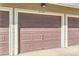 Garage doors with number of unit posted above doors at 9557 Pearl Cir # 204, Parker, CO 80134