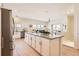 Spacious kitchen with a large granite island, stainless steel appliances, and an open layout at 9557 Pearl Cir # 204, Parker, CO 80134