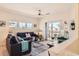 Bright living room with contemporary decor, plush seating, and access to a balcony at 9557 Pearl Cir # 204, Parker, CO 80134