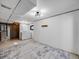 A basement with white walls and gray carpet featuring a laundry area with washer and dryer at 758 Poppywood Pl, Highlands Ranch, CO 80126