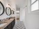 Well-appointed bathroom featuring double sinks, decorative tile flooring and a separate shower/tub at 758 Poppywood Pl, Highlands Ranch, CO 80126