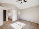 Spacious bedroom featuring a ceiling fan, vaulted ceiling and an en-suite bathroom at 758 Poppywood Pl, Highlands Ranch, CO 80126