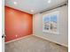 Cozy bedroom bathed in natural light with neutral carpet and vibrant accent wall for personality at 758 Poppywood Pl, Highlands Ranch, CO 80126