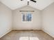 Bright, carpeted bedroom with a ceiling fan and vaulted ceiling, offering a comfortable living space at 758 Poppywood Pl, Highlands Ranch, CO 80126