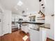 Well-lit kitchen with stainless steel appliances, an island, and granite countertops at 758 Poppywood Pl, Highlands Ranch, CO 80126