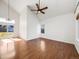 Bright living room with vaulted ceilings, hardwood floors, and a sliding glass door with natural light at 758 Poppywood Pl, Highlands Ranch, CO 80126