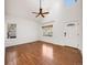 Bright living room with vaulted ceilings, hardwood floors, and big windows with natural light at 758 Poppywood Pl, Highlands Ranch, CO 80126