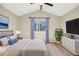 Bright main bedroom with vaulted ceiling, ceiling fan, large window and a walk-in closet at 758 Poppywood Pl, Highlands Ranch, CO 80126