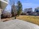 Stone patio area features a view of the backyard, grass, and a wood fence at 758 Poppywood Pl, Highlands Ranch, CO 80126