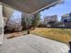 Spacious patio area with a view of the backyard, surrounded by a wood fence at 758 Poppywood Pl, Highlands Ranch, CO 80126