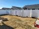 Landscaped backyard with a wooden fence and garden at 429 Beckwourth Ave, Fort Lupton, CO 80621