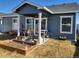 Covered patio, garden, and grilling area in backyard at 429 Beckwourth Ave, Fort Lupton, CO 80621