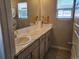 Bathroom with marble countertop, new flooring and updated fixtures at 429 Beckwourth Ave, Fort Lupton, CO 80621