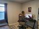 Bright home office features a desk, chair, and large window at 429 Beckwourth Ave, Fort Lupton, CO 80621