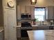 Kitchen area with stainless steel appliances and marble countertops at 429 Beckwourth Ave, Fort Lupton, CO 80621