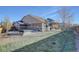 Spacious backyard featuring a hot tub and a covered patio, perfect for outdoor entertaining and relaxation at 25525 E 1St Ave, Aurora, CO 80018