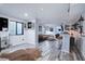 Finished basement with a modern bar area, lounge seating, and a dart board for entertainment at 25525 E 1St Ave, Aurora, CO 80018