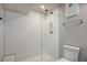 Modern bathroom featuring a glass-enclosed shower with white subway tile and sleek fixtures at 25525 E 1St Ave, Aurora, CO 80018