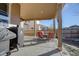 This covered patio features a grill and seating area, perfect for outdoor entertaining and relaxing at 25525 E 1St Ave, Aurora, CO 80018