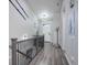 Inviting entryway featuring hardwood floors, contemporary lighting, and stylish decor elements with staircase to the left at 25525 E 1St Ave, Aurora, CO 80018