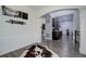 Spacious hallway leading to the kitchen, showcasing elegant wainscoting and modern flooring at 25525 E 1St Ave, Aurora, CO 80018
