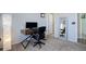 Functional home office space featuring a desk, chair, and ample lighting at 25525 E 1St Ave, Aurora, CO 80018