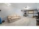 Spacious carpeted basement with ample seating, a desk, and stylish decor at 8873 Yukon St, Broomfield, CO 80021
