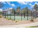 Outdoor basketball court with black fence and gravel landscaping in a common area at 8873 Yukon St, Broomfield, CO 80021