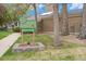 Exterior shot of the clubhouse featuring a sign with a 4-leaf clover and landscaping at 8873 Yukon St, Broomfield, CO 80021