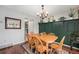 Elegant dining room featuring a wooden table with chairs, stylish light fixture and decorative shelving at 8873 Yukon St, Broomfield, CO 80021