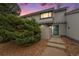Charming townhome with a blue front door and well-maintained landscaping at 8873 Yukon St, Broomfield, CO 80021