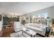Bright living room boasts a large window, modern furnishings, and sliding door access to the outdoor space at 8873 Yukon St, Broomfield, CO 80021