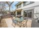 Outdoor patio area with dining table, chairs, a grill, and access to the house at 8873 Yukon St, Broomfield, CO 80021