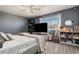 Comfortable bedroom features plush gray carpet, a large window, and a TV at 10144 Madison St, Thornton, CO 80229