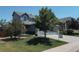 Well-manicured lawn and mature trees frame this inviting home's exterior at 10144 Madison St, Thornton, CO 80229