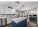 Stylish kitchen with a center island and open layout concept at 10144 Madison St, Thornton, CO 80229
