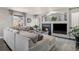 Spacious living room features a fireplace and large windows for natural light at 10144 Madison St, Thornton, CO 80229