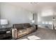Carpeted loft with comfortable theater seating and railing overlooking the floor below at 10144 Madison St, Thornton, CO 80229