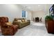 Cozy basement with plush carpeting, a comfortable sofa, and a dining area perfect for entertaining at 787 Kendall Ct, Lakewood, CO 80214