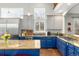 Spacious kitchen featuring granite countertops, custom cabinetry, and stainless steel appliances at 787 Kendall Ct, Lakewood, CO 80214