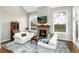 Inviting living room with fireplace, comfortable seating, and views to the outside at 787 Kendall Ct, Lakewood, CO 80214