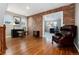Unique office space features brick, windows, hardwood floors, and an ornate chair at 787 Kendall Ct, Lakewood, CO 80214