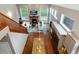 Open-concept living room with a fireplace, high ceilings, and hardwood floors, viewed from above at 787 Kendall Ct, Lakewood, CO 80214
