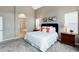 Serene main bedroom showcasing bright windows and ensuite bathroom at 787 Kendall Ct, Lakewood, CO 80214