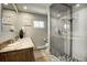 Elegant bathroom with marble vanity and walk-in shower at 4969 S Indian Trl, Evergreen, CO 80439