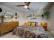 Spacious bedroom with mid-century dresser and ceiling fan at 4969 S Indian Trl, Evergreen, CO 80439