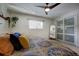 Bright bedroom with sliding door and ceiling fan at 4969 S Indian Trl, Evergreen, CO 80439