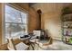 Cozy dining area with mountain views and wood-burning stove at 4969 S Indian Trl, Evergreen, CO 80439